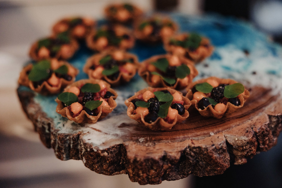 Canapés on a wooden platter by Dean Banks at The Pompadour